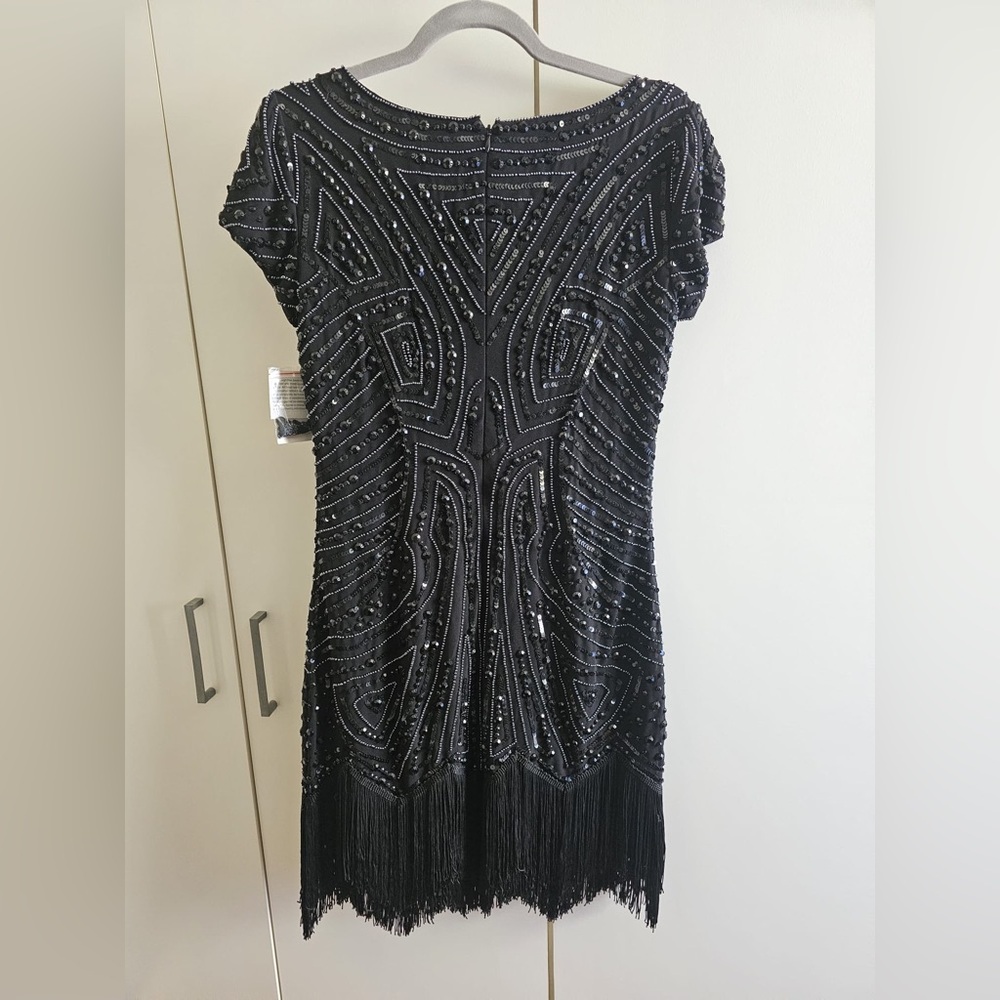 Brand new. Size 10. Aiden. Beaded.